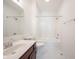 Bright bathroom featuring double shower head, large mirror, and updated vanity for a modern feel at 2332 Brightwell Pl, Indianapolis, IN 46260