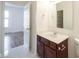 Bathroom with tiled floor, and wooden vanity offers a stylish and convenient space at 2332 Brightwell Pl, Indianapolis, IN 46260