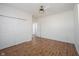 Bedroom featuring hardwood floors, a ceiling fan, and a large closet for organized storage at 2332 Brightwell Pl, Indianapolis, IN 46260