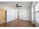 Bright bedroom features hardwood floors, ceiling fan, and ensuite bathroom for a comfortable living space at 2332 Brightwell Pl, Indianapolis, IN 46260