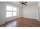 Well-lit bedroom with large window and hardwood floors, creating a bright and inviting space at 2332 Brightwell Pl, Indianapolis, IN 46260
