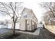 Exterior view of townhome with attached garage and back patio creating a private outdoor space at 2332 Brightwell Pl, Indianapolis, IN 46260