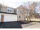 Inviting townhouse featuring a two-car garage and neutral siding at 2332 Brightwell Pl, Indianapolis, IN 46260