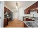 Kitchen featuring stainless steel appliances and wood cabinets, and granite countertops at 2332 Brightwell Pl, Indianapolis, IN 46260