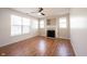 Inviting living room with fireplace, fan and abundant natural light at 2332 Brightwell Pl, Indianapolis, IN 46260