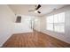 Spacious living room features wood floors, staircase, and large windows at 2332 Brightwell Pl, Indianapolis, IN 46260