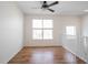 Loft space features natural light from windows and a ceiling fan, perfect for reading or relaxing at 2332 Brightwell Pl, Indianapolis, IN 46260