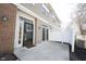 Private back patio area with neutral siding and a white decorative fence at 2332 Brightwell Pl, Indianapolis, IN 46260