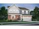 Charming two-story home with brick and gray siding, complemented by a well-manicured lawn and inviting curb appeal at 2725 Linwood Ave, Greenwood, IN 46143