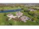 Stunning aerial view of an estate featuring a pond, mature trees and manicured grounds at 2766 S Honey Creek S Rd, Greenwood, IN 46143