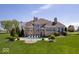 A luxurious backyard features an inground pool and plenty of patio seating at 2766 S Honey Creek S Rd, Greenwood, IN 46143