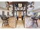 Entertaining basement bar area with unique mirrored ceiling and stone accents at 2766 S Honey Creek S Rd, Greenwood, IN 46143