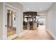 Basement bar area is located off of a hallway with tile flooring at 2766 S Honey Creek S Rd, Greenwood, IN 46143