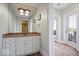 This bathroom boasts a dual sink vanity and a glass door to the back patio at 2766 S Honey Creek S Rd, Greenwood, IN 46143