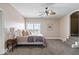 Spacious bedroom featuring plush carpet, a large window with view, and neutral decor at 2766 S Honey Creek S Rd, Greenwood, IN 46143