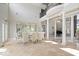 Formal dining area with elegant glass table, plush seating, and view of the grand piano at 2766 S Honey Creek S Rd, Greenwood, IN 46143
