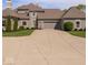 Spacious driveway leading to a two-car garage with manicured lawns and a neutral palette at 2766 S Honey Creek S Rd, Greenwood, IN 46143
