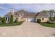 Charming home with a long driveway and well manicured landscaping at 2766 S Honey Creek S Rd, Greenwood, IN 46143
