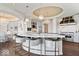 Modern kitchen with an island with seating, designer lighting, and state-of-the-art stainless steel appliances at 2766 S Honey Creek S Rd, Greenwood, IN 46143