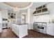 Gourmet kitchen featuring stainless steel appliances, a center island, and custom cabinetry at 2766 S Honey Creek S Rd, Greenwood, IN 46143
