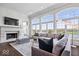 Bright living room with fireplace, large windows, and comfortable seating at 2766 S Honey Creek S Rd, Greenwood, IN 46143