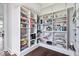 Well-organized pantry with white shelving and visible food supplies at 2766 S Honey Creek S Rd, Greenwood, IN 46143