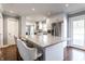 Bright kitchen with a large island, modern appliances, and comfortable seating for casual dining at 320 E 86Th St, Indianapolis, IN 46240