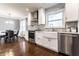 Beautiful kitchen featuring stainless steel appliances, white cabinets, subway tile backsplash, and dining area at 320 E 86Th St, Indianapolis, IN 46240
