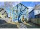 Charming backyard view of the house with blue siding and yellow trim at 3224 N Capitol Nw Ave, Indianapolis, IN 46208