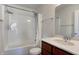 Well-lit bathroom featuring a shower over tub, neutral paint, and modern fixtures at 3224 N Capitol Nw Ave, Indianapolis, IN 46208