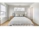 Brightly lit bedroom featuring a large window and hardwood floors at 3224 N Capitol Nw Ave, Indianapolis, IN 46208