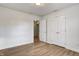 Bright bedroom features wood-look flooring, closet, and an open doorway at 3224 N Capitol Nw Ave, Indianapolis, IN 46208