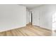 Bright bedroom with wood-look flooring and closet at 3224 N Capitol Nw Ave, Indianapolis, IN 46208