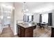 Open-concept living room view showcases the dining area and a glimpse into the home's welcoming interior at 3224 N Capitol Nw Ave, Indianapolis, IN 46208