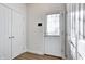 Bright mud room with white doors, tiled floors and natural light at 3224 N Capitol Nw Ave, Indianapolis, IN 46208
