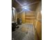 Basement featuring water heater, furnace, and patterned flooring at 3614 N Whittier Pl, Indianapolis, IN 46218