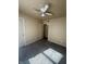 Bedroom featuring neutral walls, ceiling fan and an open door at 3614 N Whittier Pl, Indianapolis, IN 46218