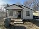 Modest single-story home with a small front porch and landscaping at 3614 N Whittier Pl, Indianapolis, IN 46218