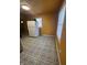 Kitchen features an electric stove, a refrigerator, and dated cabinets at 3614 N Whittier Pl, Indianapolis, IN 46218