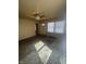 Spacious living room featuring natural light and a ceiling fan at 3614 N Whittier Pl, Indianapolis, IN 46218
