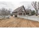 Spacious backyard deck with white picket fence, perfect for outdoor entertaining at 37 N Main St, Indianapolis, IN 46227
