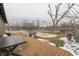 Spacious wood deck overlooks backyard featuring a covered pool, storage shed, and a playhouse at 37 N Main St, Indianapolis, IN 46227