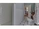 Bright bathroom featuring a tiled shower and floor at 37 N Main St, Indianapolis, IN 46227