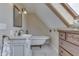 Stylish bathroom with a clawfoot tub, vanity sink and a skylight at 37 N Main St, Indianapolis, IN 46227