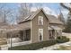 Charming two-story home featuring detailed trim and a covered patio with barbecue at 37 N Main St, Indianapolis, IN 46227