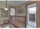 Upstairs hallway with natural light, wood railing and views into adjacent rooms at 37 N Main St, Indianapolis, IN 46227