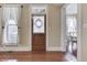 Bright living room showcasing hardwood floors and large windows with natural light at 37 N Main St, Indianapolis, IN 46227
