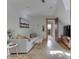 Cozy living room with hardwood floors, a comfortable sofa and natural light at 37 N Main St, Indianapolis, IN 46227