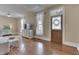 Light-filled living room with a decorative fireplace and windows at 37 N Main St, Indianapolis, IN 46227