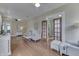 Open-concept living room with hardwood flooring and elegant decor at 37 N Main St, Indianapolis, IN 46227